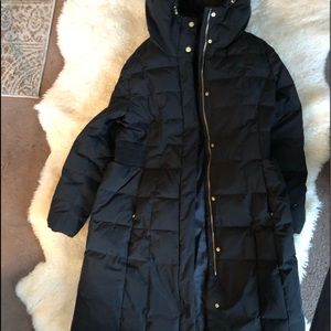 A NWOT down and feather filled long winter coat.